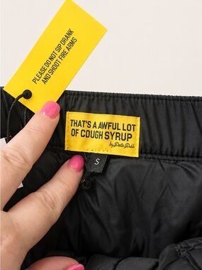 Black Puffer Mini Skirt with Yellow "That's Awful Lot of Cough Syrup" Patch
